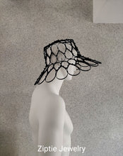 Load image into Gallery viewer, Black avant-garde sculptural hat made from zip ties worn by a mannequin.
