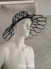 Load image into Gallery viewer, Black avant-garde sculptural hat made from zip ties worn by a mannequin.
